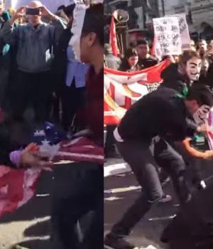 Con m&aacute;scaras queman bandera yanqui contra el FMI